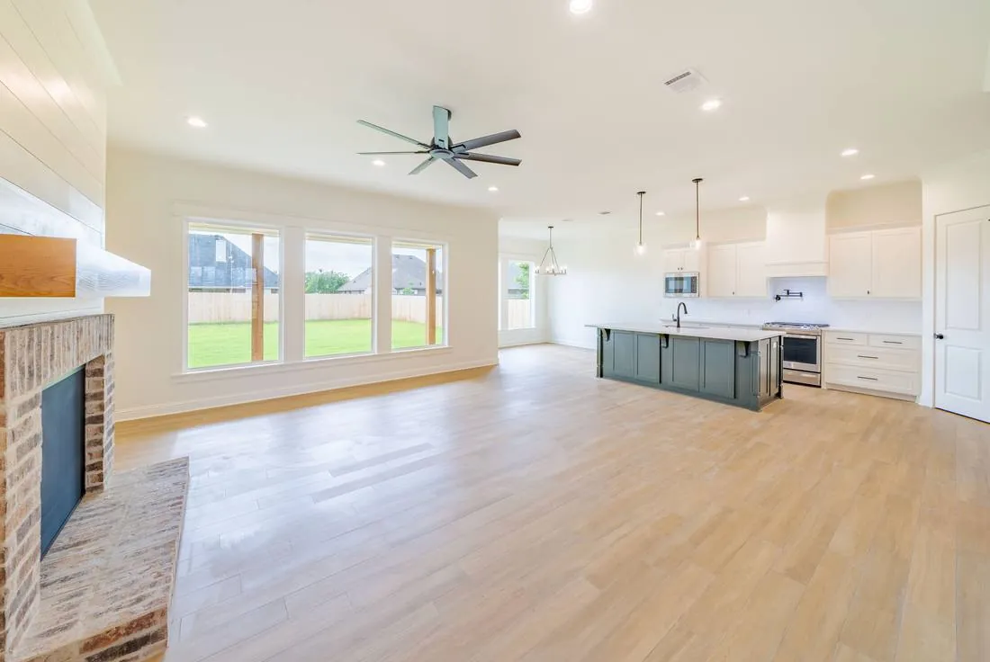 Open-concept kitchen and living room renovation by J2 Construction